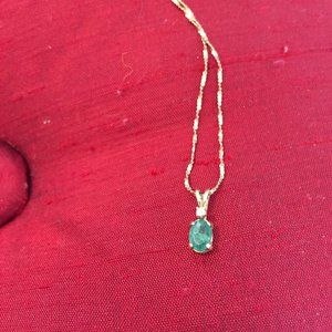 Emerald and diamond pendant with gold chain